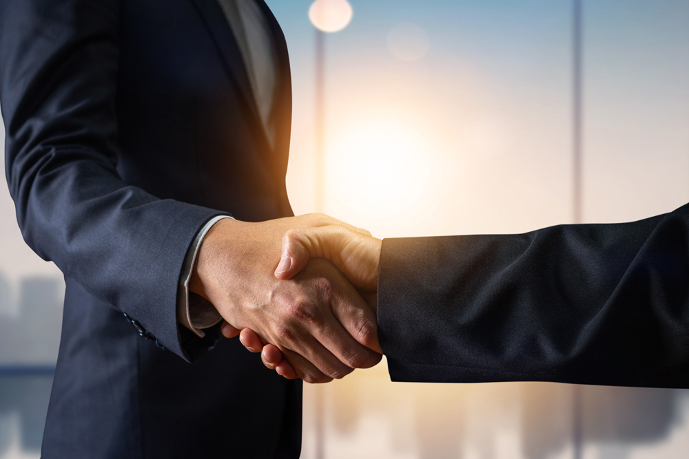 Business agreement and successful negotiation concept, businessman in suit shake hand with customer, client after formal communication and contract deal success